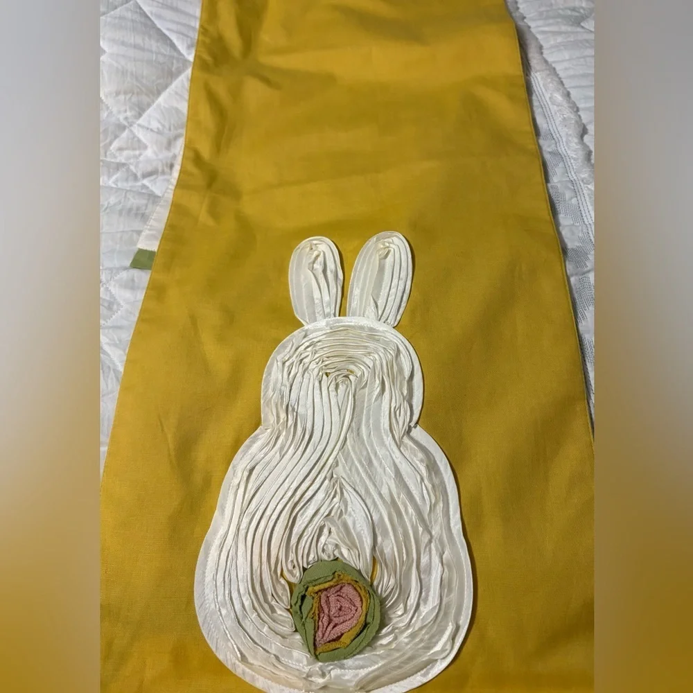 Cute bunny table runner by Pier 1 Imports. Golden yellow with cream bunnies.